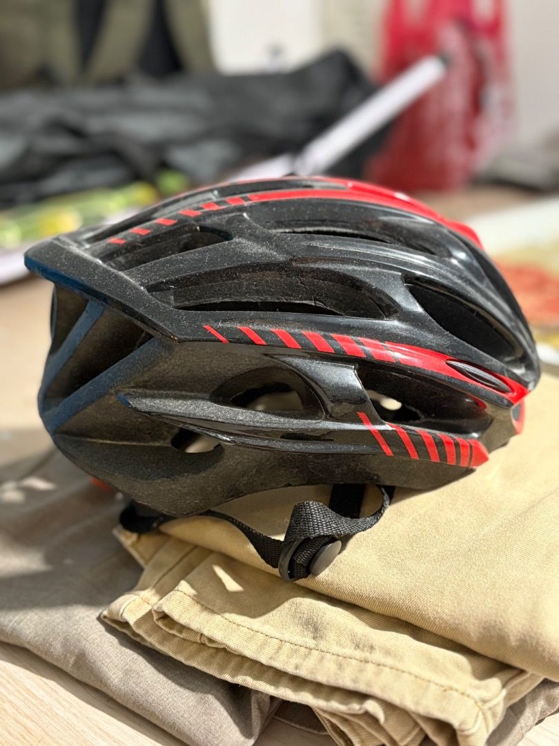 Adult Bicycle Helmet with Rear Light (Category: Bicycles) located in Quezon City. Submitted by camille_cr (Listing ID 1461794271, Image 1). Description: - Adult bicycle helmet - Built-in rear light with orange lens - Adjustable straps with red buckle - Enhances cycling safety - Ready for your next adventure.