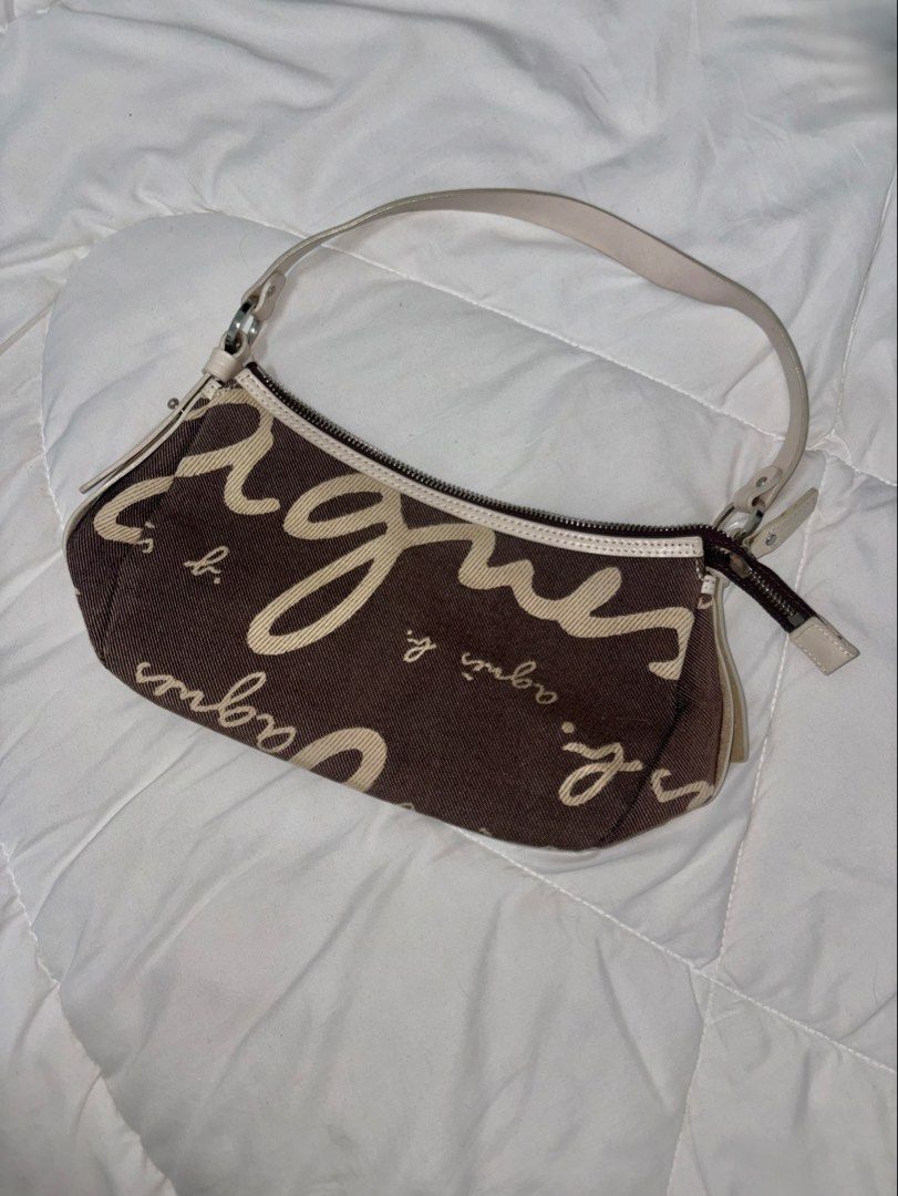 agnès b. VOYAGE Shoulder Bag (Category: Shoulder Bags) located in Manila. Submitted by weararchive.mnl (Listing ID 1461746804, Image 1). Description: FIXED PRICE Preloved but in good condition 🤎 • Brown/cream monogram design • Zipper closure • Shoulder strap • Perfect for everyday use.