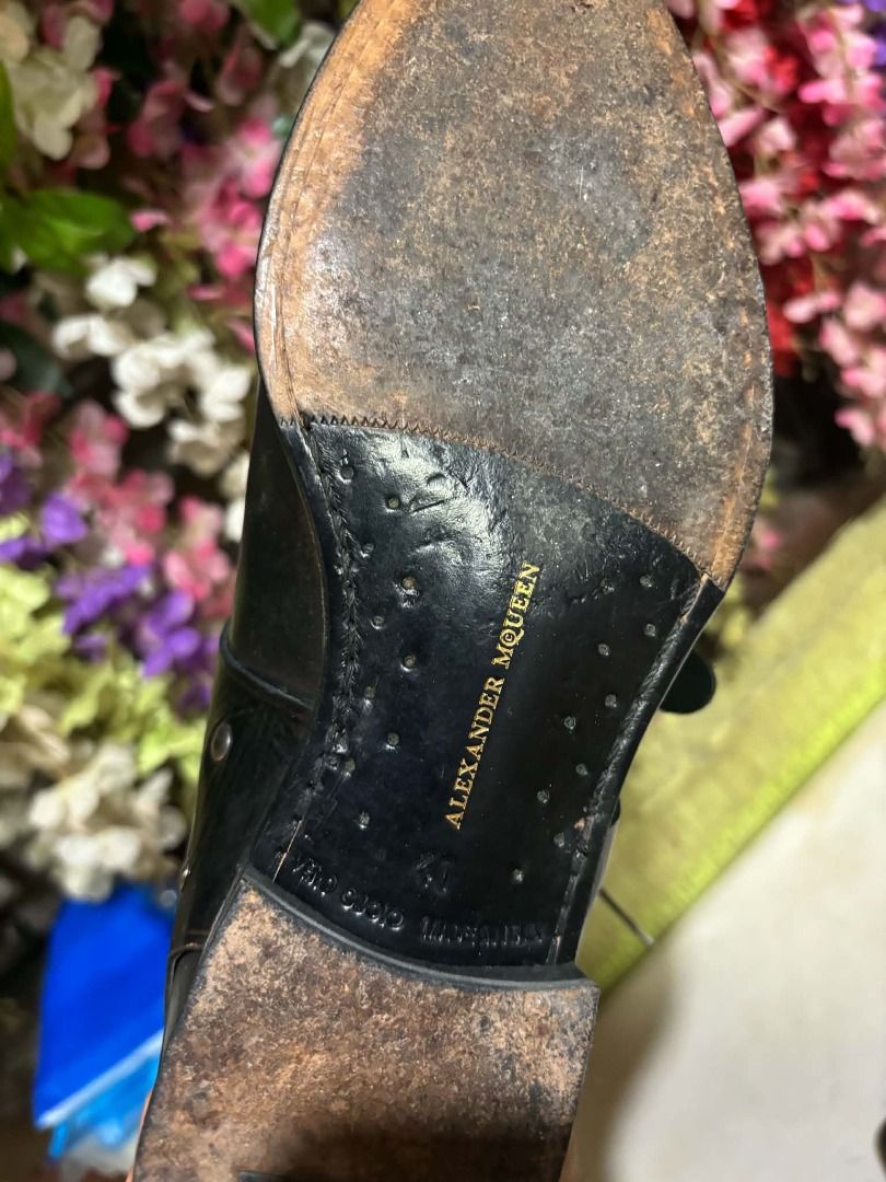 Alexander McQueen Black Leather Monk Strap Shoes (Category: Dress Shoes) located in Manila. Submitted by robrob1 (Listing ID 1461794309, Image 2). Description: - Brand: Alexander McQueen (designer shoes) - Color: Black - Material: Leather - Style: Monk Strap with Buckle Closure - Closure: Lace-up front - Sole: Leather with embossed brand name - Size: 41 (8.5-9) - Condition: Some wear on soles and insoles - Versatility: Great for dressing up or do