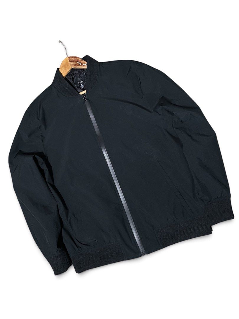 Alfani Black Bomber Jacket (Category: Coats, Jackets and Outerwear) located in Munoz. Submitted by bb_jimbo0 (Listing ID 1461746757, Image 1). Description: - Classic black bomber jacket by Alfani - Zip-up front closure - Ribbed collar, cuffs, and hem for a snug fit - Lightweight material, perfect for layering - Versatile and easy to style with any outfit 22 W 27 L.