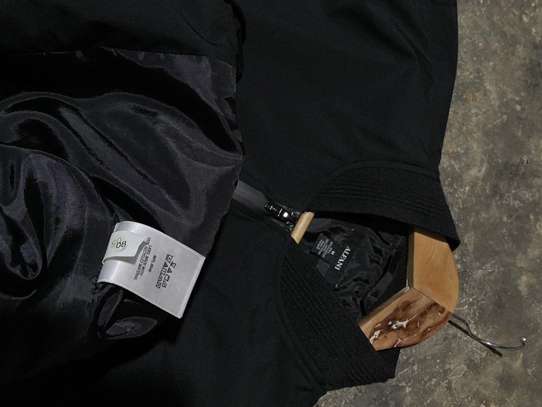Alfani Black Bomber Jacket (Category: Coats, Jackets and Outerwear) located in Munoz. Submitted by bb_jimbo0 (Listing ID 1461746757, Image 3). Description: - Classic black bomber jacket by Alfani - Zip-up front closure - Ribbed collar, cuffs, and hem for a snug fit - Lightweight material, perfect for layering - Versatile and easy to style with any outfit 22 W 27 L.