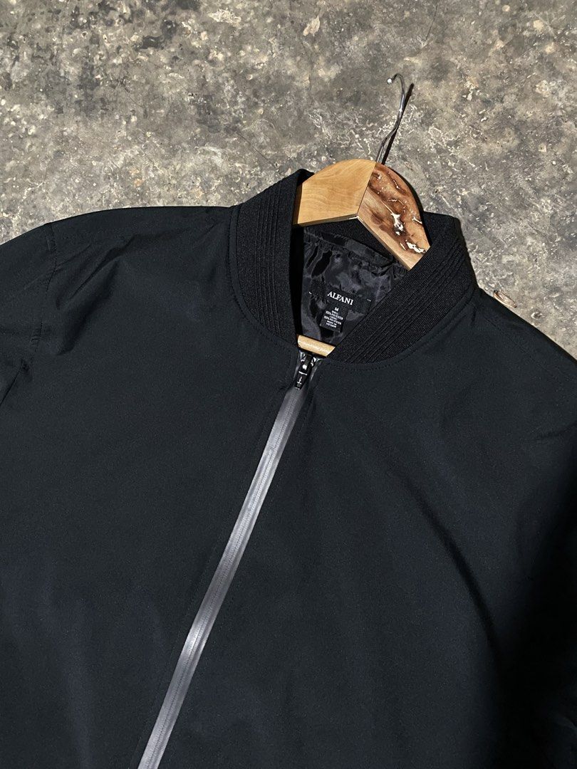 Alfani Black Bomber Jacket (Category: Coats, Jackets and Outerwear) located in Munoz. Submitted by bb_jimbo0 (Listing ID 1461746757, Image 2). Description: - Classic black bomber jacket by Alfani - Zip-up front closure - Ribbed collar, cuffs, and hem for a snug fit - Lightweight material, perfect for layering - Versatile and easy to style with any outfit 22 W 27 L.