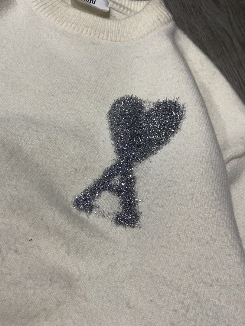 Ami Paris Big Logo Knitted Sweater (Category: Coats, Jackets and Outerwear) located in Manila. Submitted by maisongrails (Listing ID 1461618266, Image 2). Description: Ami Paris Big Logo Knitted Sweater Dimes: 25x22 Condition: 7.5/10 Color rate: 8/10 Issue/s: Lints, small stains on neckline and on lower part (check photos) Price: ₱1,899.