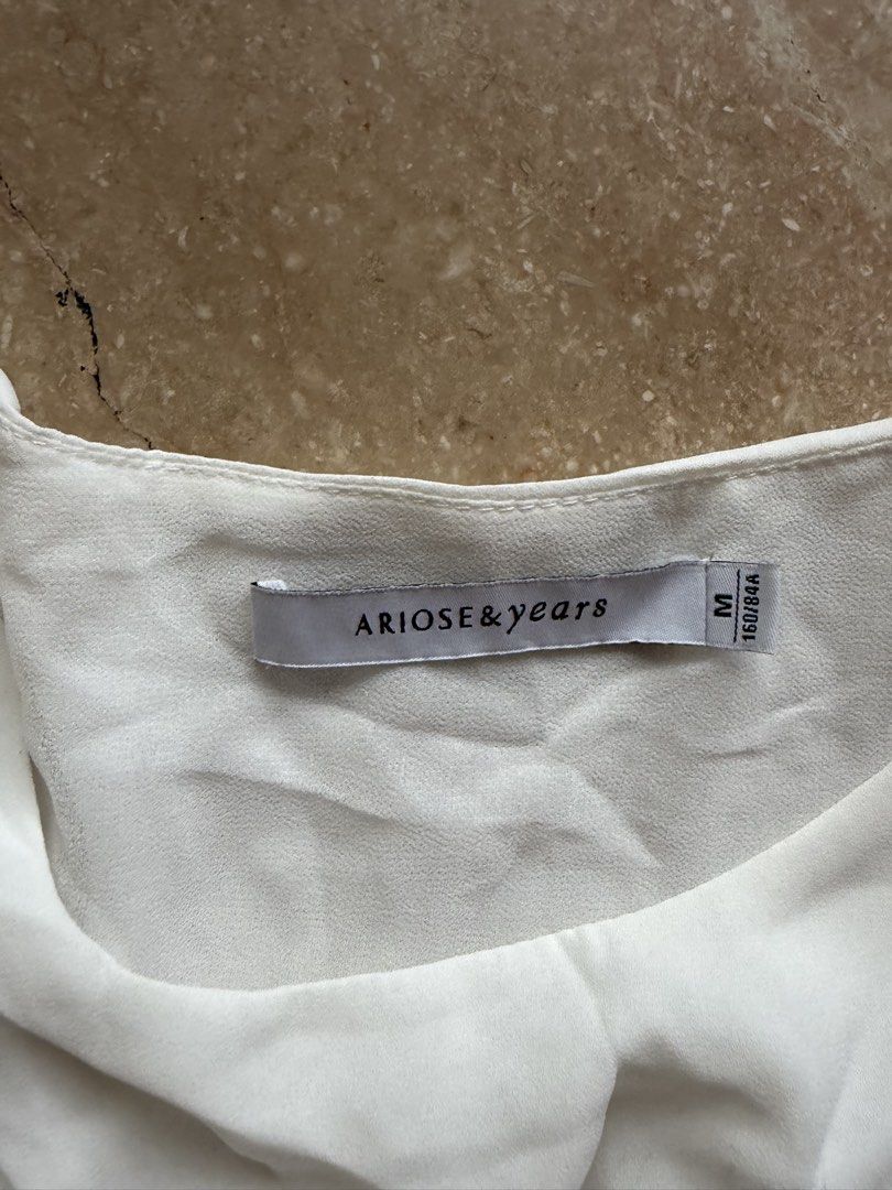 Ariose & Years White Sleeveless Top (Category: Others Tops) located in Quezon City. Submitted by tidyup.lara (Listing ID 1461568488, Image 3). Description: Size M Shoulder 15” Bust 34” Waist 36” Length 24” Condition 8/10: used but in good condition, with stains.