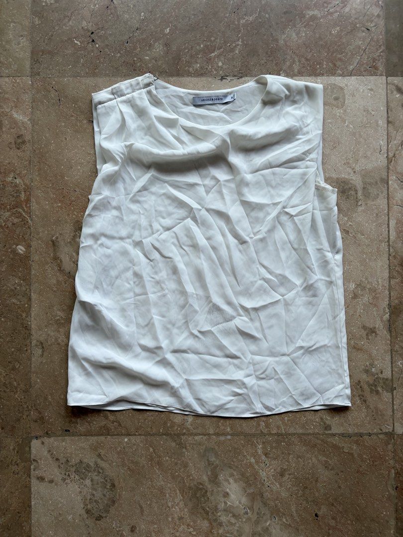 Ariose & Years White Sleeveless Top (Category: Others Tops) located in Quezon City. Submitted by tidyup.lara (Listing ID 1461568488, Image 1). Description: Size M Shoulder 15” Bust 34” Waist 36” Length 24” Condition 8/10: used but in good condition, with stains.
