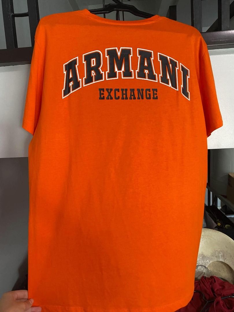 Armani Tees (Category: Tshirts & Polo Shirts ) located in Caloocan City. Submitted by purefalcon.974eee (Listing ID 1461603800, Image 2). Description: Brand new Armani Exchange Orange Tee with Logo on front and Back.