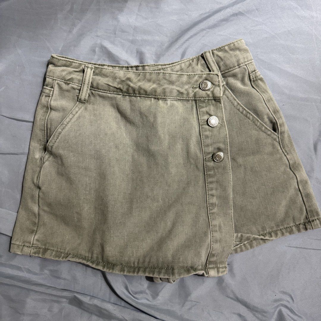 Army Green Denim Skort (Category: Skirts) located in Cagayan de Oro. Submitted by kheyx (Listing ID 1461606975, Image 1). Description: 23-24 - Closure: Button and zip - Pockets: Two front, two back - Fabric: 87% cotton.