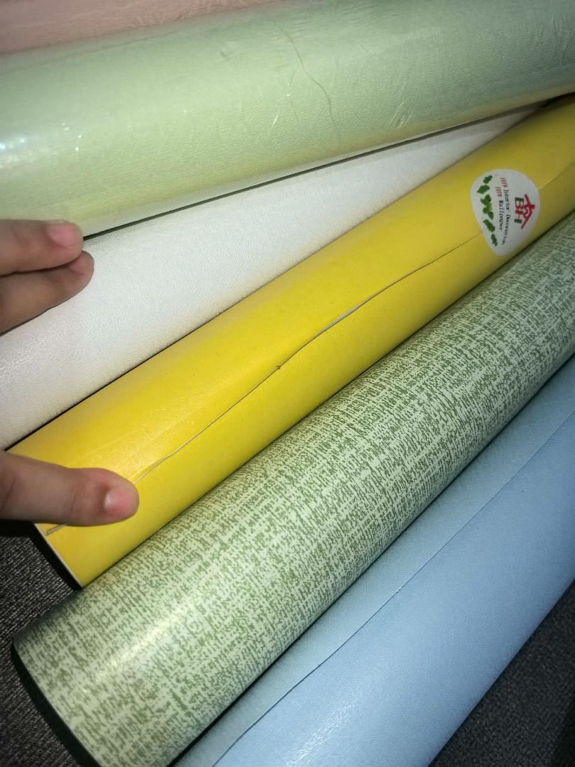 Assorted Wallpaper Rolls - Various Colors and Patterns (Category: Craft Supplies & Tools) located in Quezon City. Submitted by suzannegrace (Listing ID 1461768886, Image 1). Description: TAKE ALL - majority are not use, new new new - Assorted wallpaper rolls available - Colors: White, Red, Cream, Lavender, Pink, Light Green, Yellow, Green Patterned, Light Blue, Dark Blue - Some rolls feature a textured finish - Ideal for DIY projects and home red