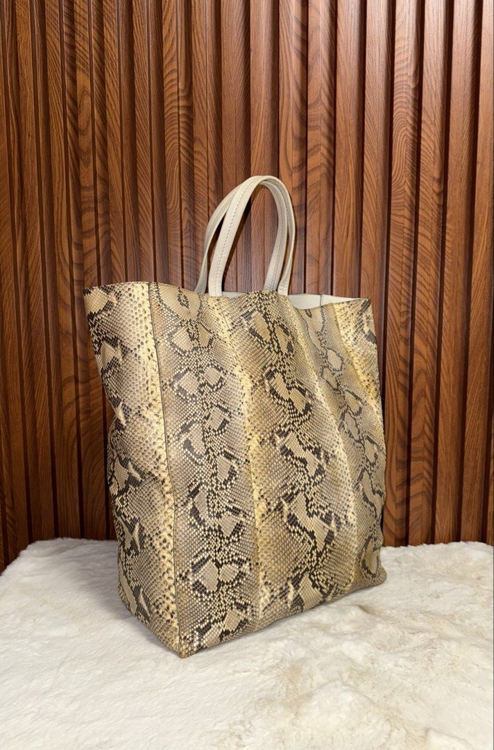 Authentic Celine Tote Bag (Category: Luxury Bags & Wallets) located in Subic. Submitted by luxshoppe88 (Listing ID 1461591401, Image 2). Description: - Authentic celine tote bag - Natural earthy tones with unique pattern - Cream leather handles and interior lining - Spacious main compartment - Internal zip pocket - Slouchy, relaxed silhouette - Ideal for everyday use or travel mode of payment : bpi and gcash shipping will be done once payment con