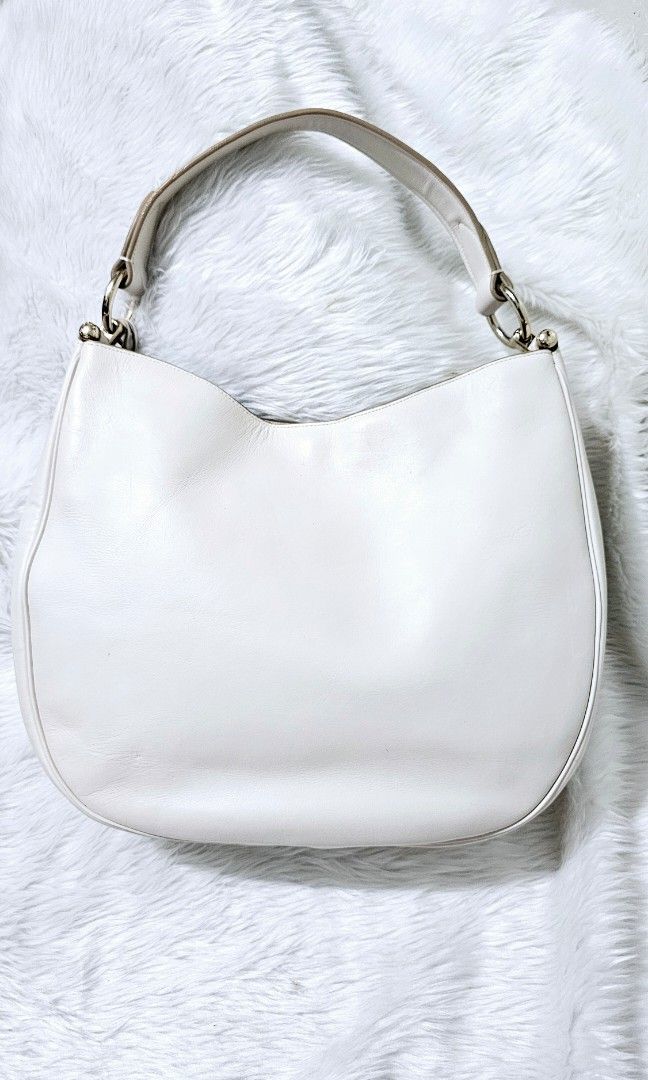 AUTHENTIC COACH NOMAD HOBO BAG (Category: Shoulder Bags) located in Bulacan. Submitted by misyeljane (Listing ID 1461668989, Image 2). Description: PRELOVED ❤️ COACH NOMAD HOBO BAG IN WHITE COLOR MISSING LONG STRAP RUBBER LININGS INTACT NO CRACKS GENUINE LEATHER YKK ZIP MADE IN VIETNAM MEDIUM TO LARGE SIZE MINIMAL SIGNS OF USE. PM FOR MORE INFO.