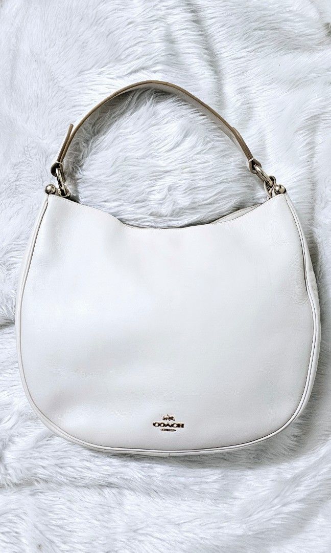 AUTHENTIC COACH NOMAD HOBO BAG (Category: Shoulder Bags) located in Bulacan. Submitted by misyeljane (Listing ID 1461668989, Image 1). Description: PRELOVED ❤️ COACH NOMAD HOBO BAG IN WHITE COLOR MISSING LONG STRAP RUBBER LININGS INTACT NO CRACKS GENUINE LEATHER YKK ZIP MADE IN VIETNAM MEDIUM TO LARGE SIZE MINIMAL SIGNS OF USE. PM FOR MORE INFO.