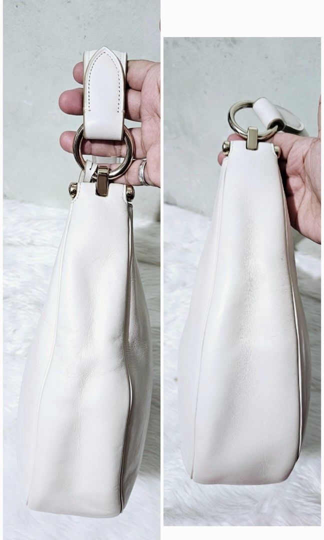 AUTHENTIC COACH NOMAD HOBO BAG (Category: Shoulder Bags) located in Bulacan. Submitted by misyeljane (Listing ID 1461668989, Image 3). Description: PRELOVED ❤️ COACH NOMAD HOBO BAG IN WHITE COLOR MISSING LONG STRAP RUBBER LININGS INTACT NO CRACKS GENUINE LEATHER YKK ZIP MADE IN VIETNAM MEDIUM TO LARGE SIZE MINIMAL SIGNS OF USE. PM FOR MORE INFO.