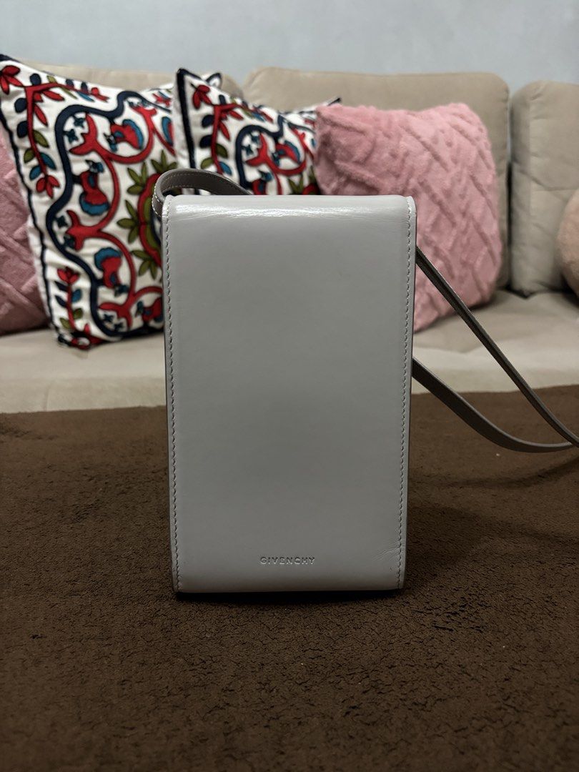 Authentic Givenchy Mini 4G Vertical Bag (Cloud Grey) (Category: Luxury Bags & Wallets) located in Pasig City. Submitted by pat.soriano (Listing ID 1461659753, Image 3). Description: I’m selling my authentic Givenchy Mini 4G Vertical Bag in Cloud Grey color. Bought last 2022 from EDSA Shangrila Givenchy boutique. Its original price was ₱55,500. Condition: Lightly Used. There are a few light creases on the leather that are not visible unless closel