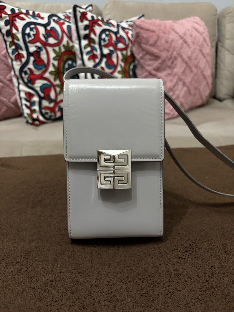 Authentic Givenchy Mini 4G Vertical Bag (Cloud Grey) (Category: Luxury Bags & Wallets) located in Pasig City. Submitted by pat.soriano (Listing ID 1461659753, Image 2). Description: I’m selling my authentic Givenchy Mini 4G Vertical Bag in Cloud Grey color. Bought last 2022 from EDSA Shangrila Givenchy boutique. Its original price was ₱55,500. Condition: Lightly Used. There are a few light creases on the leather that are not visible unless closel