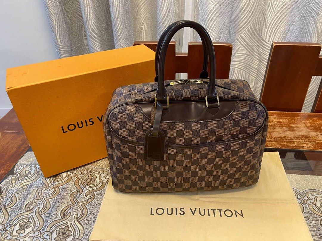Authentic Louis Vuitton (Category: Luxury Bags & Wallets) located in Manila. Submitted by chloe_luxuries (Listing ID 1461716853, Image 1). Description: Guaranteed original Louis Vuitton Deauville in Damier Ebene Still in good condition Comes with dustbag and box Pm me for more details.