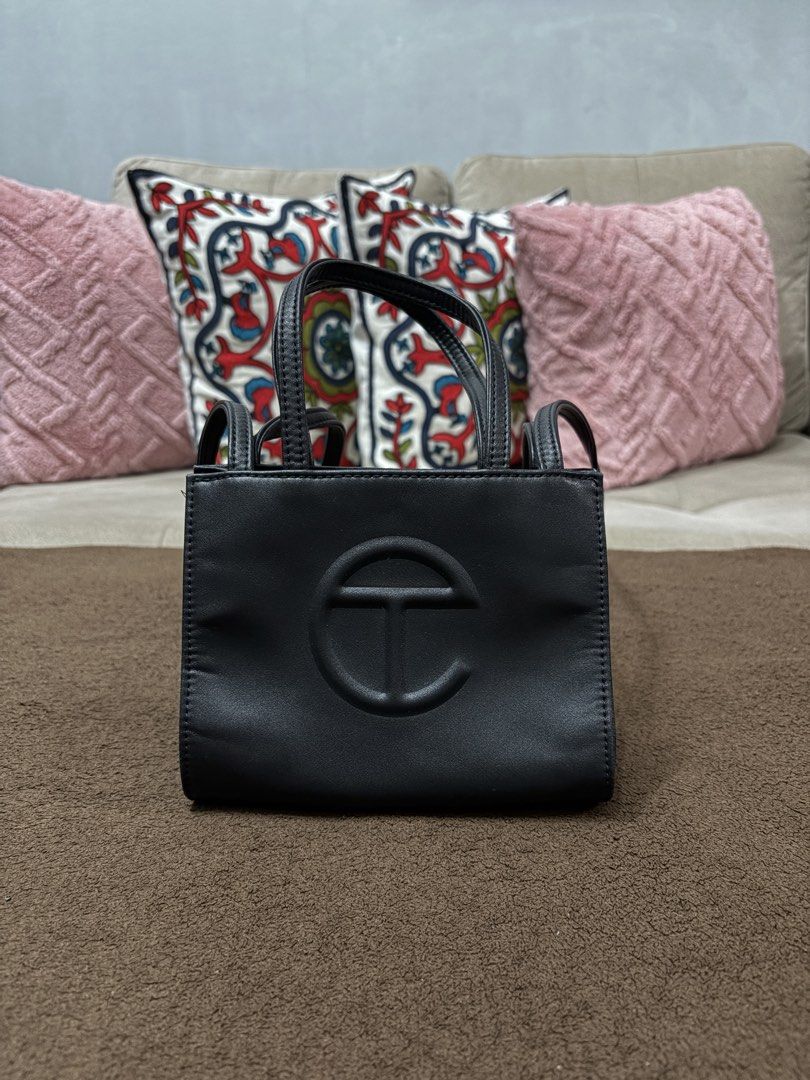 Authentic Telfar Black Shopping Bag (Small) (Category: Tote Bags) located in Pasig City. Submitted by pat.soriano (Listing ID 1461657340, Image 2). Description: I’m selling my authentic Telfar black Shopping Bag in small size. Bought last 2022 from the official Telfar USA website. Its original price was $150 (₱9,300) excluding shipping and tax. Condition: Like New. The bag is in excellent condition with no issues. Reason for selling: I rarely use