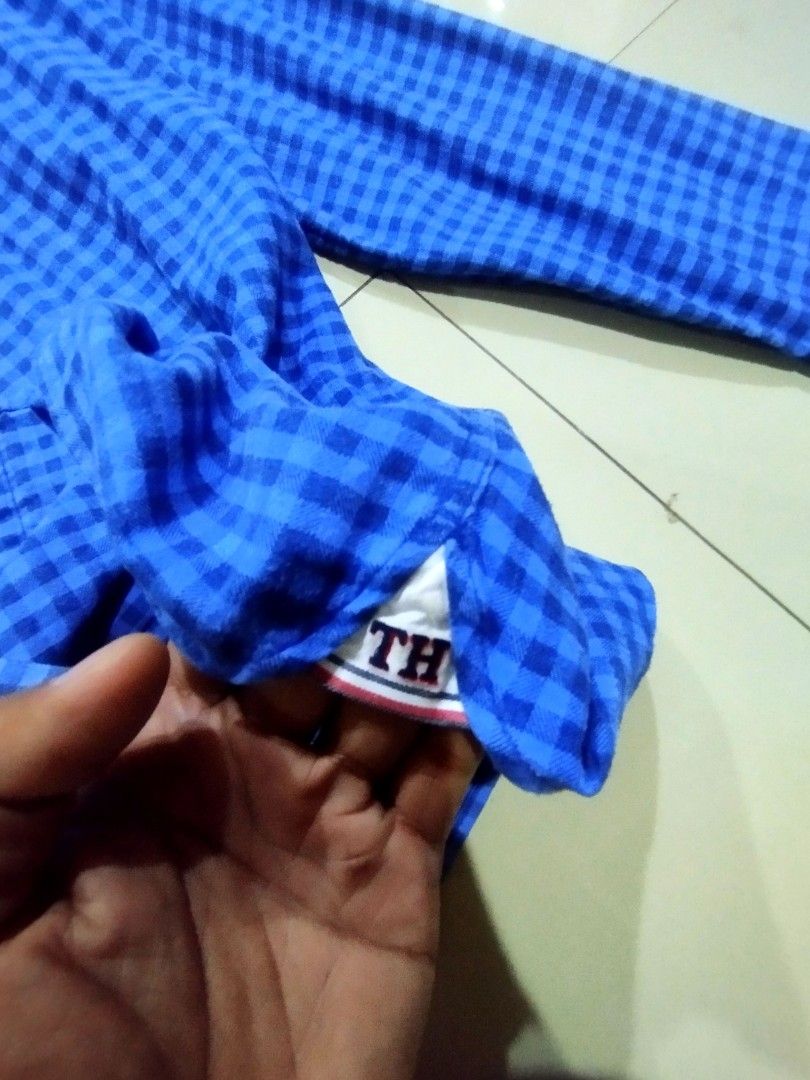 Authentic Tommy Hilfiger Blue Gingham Slim Fit Button Down Shirt Size L (Category: Formal Shirts) located in Manila. Submitted by onimusha032014 (Listing ID 1461690857, Image 3). Description: - Tommy Hilfiger Blue Gingham Shirt - Size: L - Fit: Slim Fit - Style: Button-Down - Pattern: Classic Checkered - Condition: Good, no obvious flaws - Perfect for casual or smart-casual occasions.