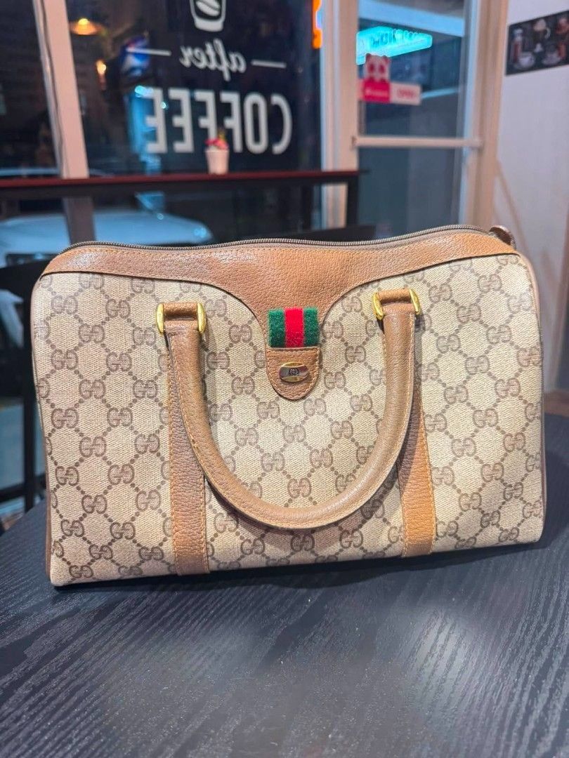 AUTHENTIC Vintage GG Web Supreme Boston Bag (Category: Luxury Bags & Wallets) located in Dasmarinas. Submitted by yg_swoosh (Listing ID 1461584961, Image 1). Description: AUTHENTIC Vintage Gucci GG Web Supreme Boston Bag -From the Gucci Accessories Collection from the 1970's-1980's -Used 3 times only. No tears or damage. Interior is a little worn in spots from age, not use. -with authentic dust bag.