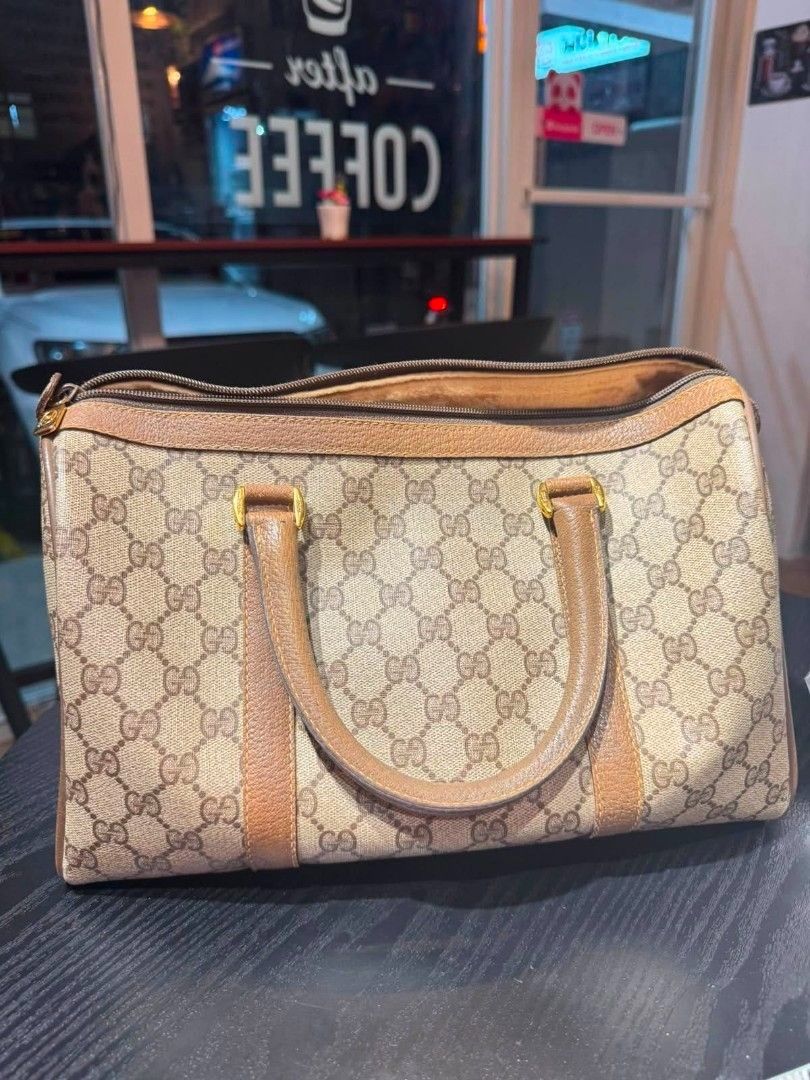 AUTHENTIC Vintage GG Web Supreme Boston Bag (Category: Luxury Bags & Wallets) located in Cavite. Submitted by yg_elite (Listing ID 1461584997, Image 2). Description: AUTHENTIC Vintage Gucci GG Web Supreme Boston Bag -From the Gucci Accessories Collection from the 1970's-1980's -Used 3 times only. No tears or damage. Interior is a little worn in spots from age, not use. -with authentic dust bag.