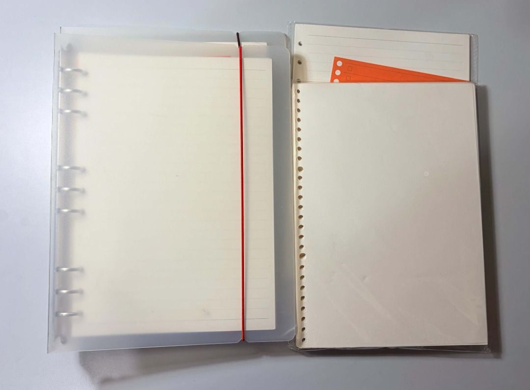 B5 binder set with extra refill fillers (Category: Stationery & School Supplies) located in Baguio. Submitted by ellamell (Listing ID 1461576405, Image 2). Description: Inclusions: • B5 binders • Extra refill papers • Fillers available: ✓ Dotted ✓ Lined ✓ Blank ✓ Index 📌 Condition: • Used before but still in good condition • Removed pages with ink marks — remaining fillers are clean and usable • May have minor signs of use/storage (light scratch