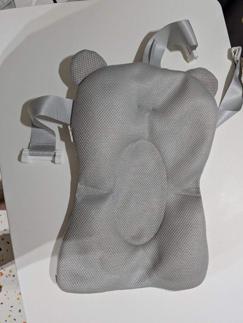 Baby Bath Support Pillow with Straps (Category: Bathtub & Bath Accessories) located in Manila. Submitted by coolshark888 (Listing ID 1461593360, Image 3). Description: - Soft padded pillow for baby's bath time - Features secure straps to keep baby safe - Reversible design: white with stars on one side, grey mesh on the other - Ensures baby's comfort and safety in the tub - Easy to use and clean.