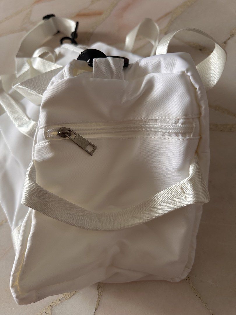 Bag (Category: Tote Bags) located in Singapore. Submitted by 7rainbow7 (Listing ID 1461659482, Image 4). Description: Length 15 inches Height 9 inches Width 7 inches Great for sports or travel Many compartments Behind Flap for sliding into luggage Convenient location can be arranged or by mail .