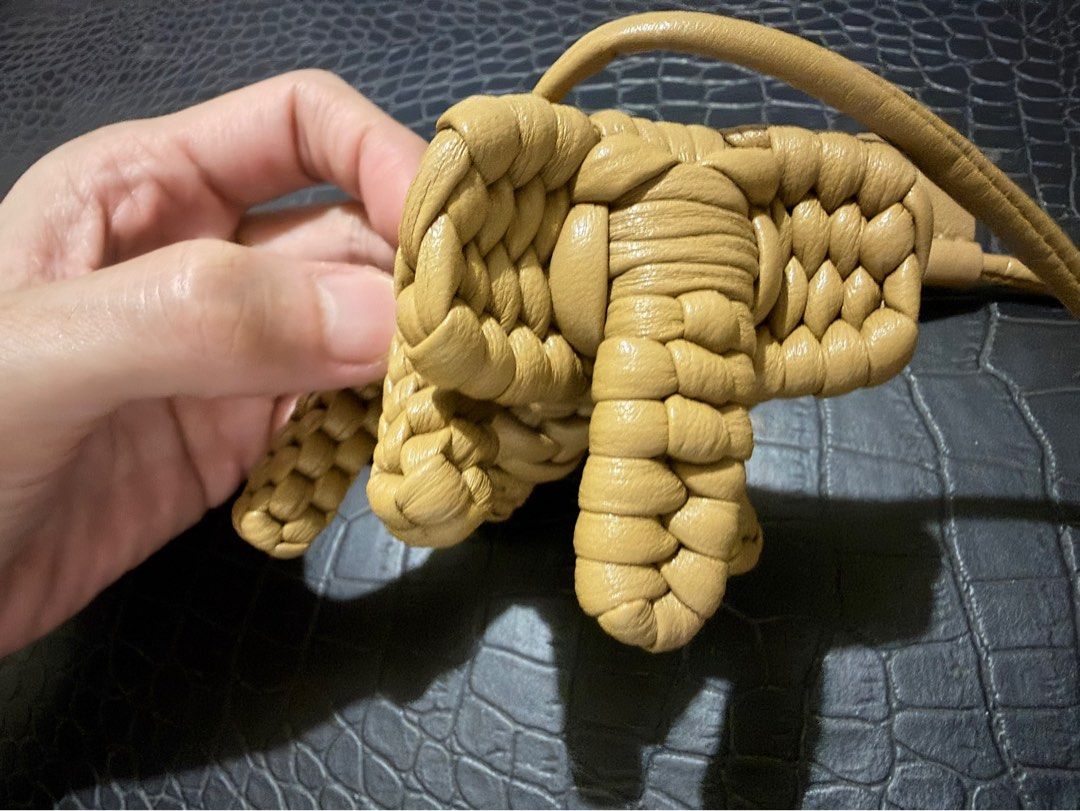 Bag charm-Woven Leather Knot Charm Keychain (Category: Charms) located in Cavite. Submitted by luckygingerivy (Listing ID 1461680547, Image 2). Description: - Woven leather charm made from Lambskin - Unique knot or little creature design - Tan color - Includes a leather strap with a loop - Ideal for decorating bags or keychains.