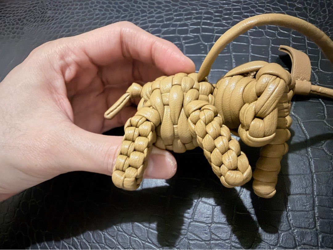 Bag charm-Woven Leather Knot Charm Keychain (Category: Charms) located in Cavite. Submitted by luckygingerivy (Listing ID 1461680547, Image 3). Description: - Woven leather charm made from Lambskin - Unique knot or little creature design - Tan color - Includes a leather strap with a loop - Ideal for decorating bags or keychains.