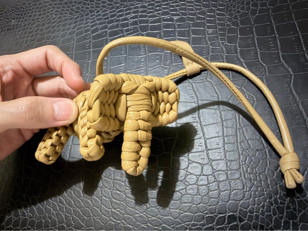 Bag charm-Woven Leather Knot Charm Keychain (Category: Charms) located in Cavite. Submitted by luckygingerivy (Listing ID 1461680547, Image 1). Description: - Woven leather charm made from Lambskin - Unique knot or little creature design - Tan color - Includes a leather strap with a loop - Ideal for decorating bags or keychains.