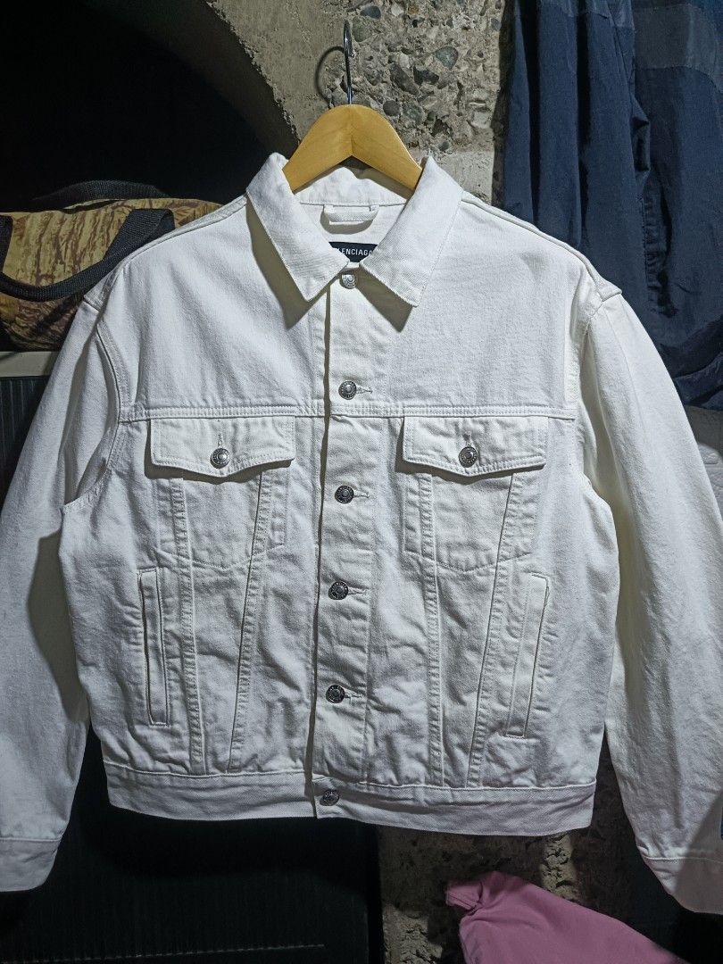 Balenciaga Denim Jacket (Category: Coats, Jackets and Outerwear) located in Caloocan City. Submitted by gemfinder669 (Listing ID 1461724444, Image 1). Description: - Brand: Balenciaga - Type: Denim Jacket - Color: White - Size: L (EU 52 / UK 42 / US 42) - Design: Classic denim jacket style with iconic Balenciaga logo embroidered on the back - Material: Denim - Style: Luxury streetwear Measurements: 23' width 24.5' length Color rate: 9.5/10 Condit