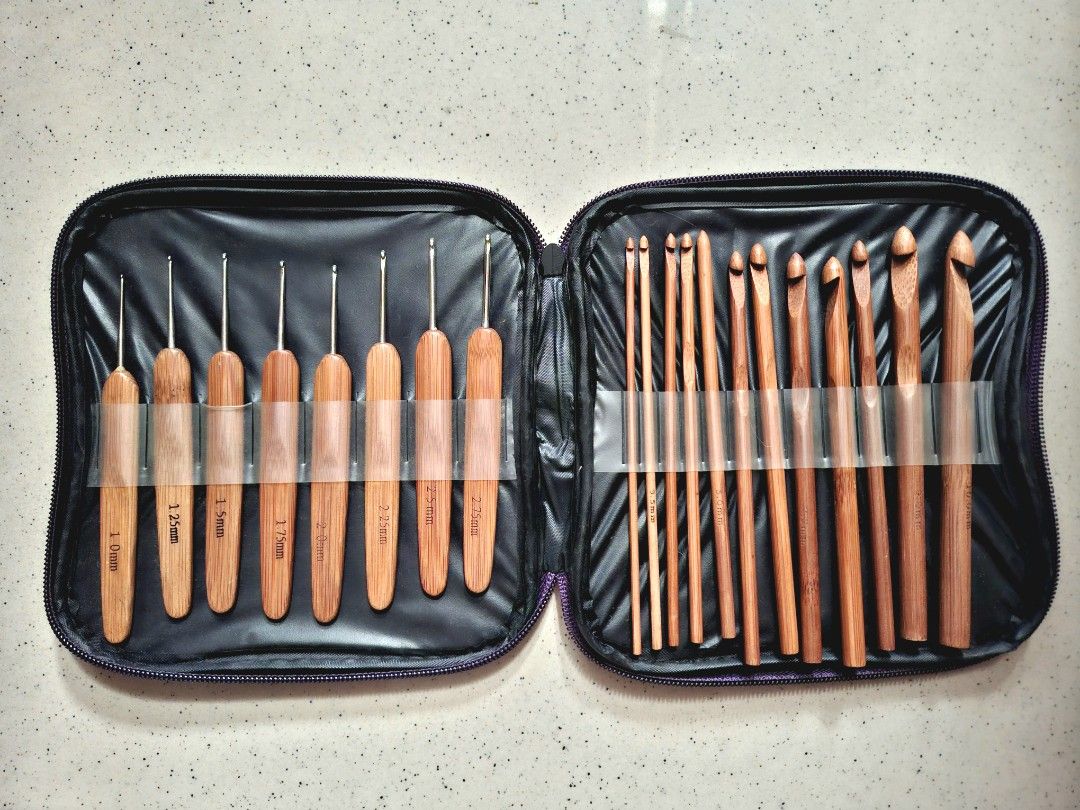 Bamboo Crochet Hooks Set with Zippered Case (Category: Craft Supplies & Tools) located in Quezon City. Submitted by justanothercatlady (Listing ID 1461636409, Image 1). Description: - Complete set of crochet hooks - Includes both metal and bamboo hooks - Various sizes available - Stored in a convenient purple zippered case - Ideal for all crochet projects - Easy to carry and travel with.