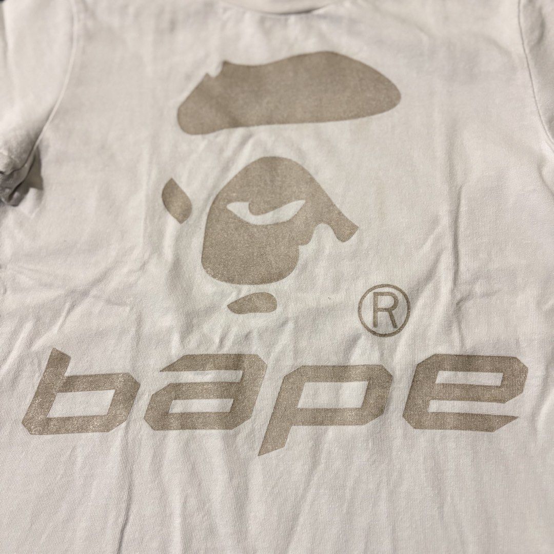BAPE KIDS by A Bathing Ape Graphic Tee (Category: Babies & Kids Fashion) located in Cabanatuan. Submitted by house.of.thrift4 (Listing ID 1461730271, Image 2). Description: White BAPE KIDS t-shirt with iconic ape head and 'bape' logo. Authentic A Bathing Ape. Perfect for fans!.