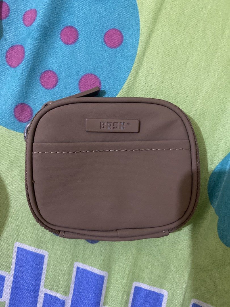 Bash Coin Pouch (Category: Purses & Pouches) located in Iloilo. Submitted by lnnlryn (Listing ID 1461724922, Image 1). Description: - Bash taupe pouch - Zippered closure - Ideal for coins and small essentials - Compact and portable - Simple, functional design.