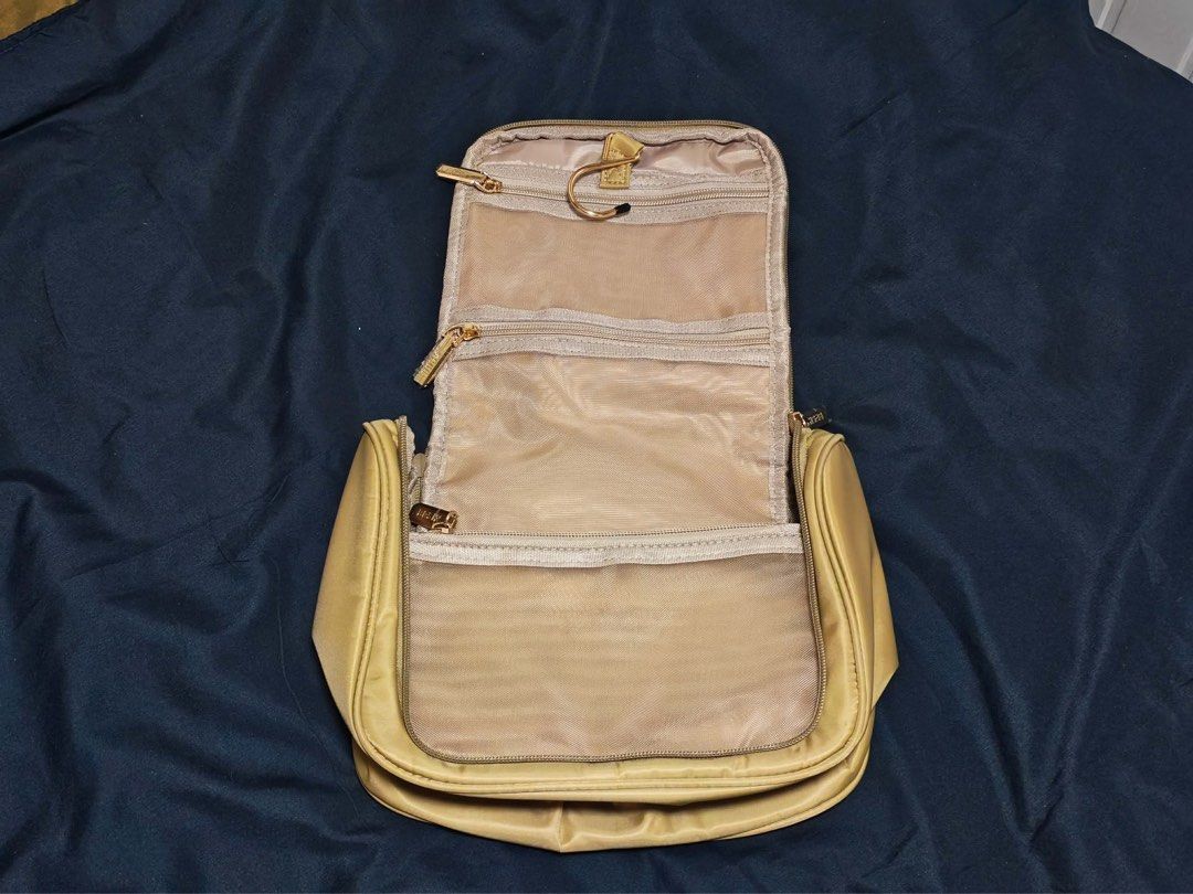 BASH Manila Unfold Organizer (Hanging Travel Bag) (Category: Travel Essentials & Accessories) located in Manila. Submitted by _ljsells (Listing ID 1461746089, Image 2). Description: Brand: BASH Manila Model: Unfold Organizer Color: Tan / Oat Condition: Pre-owned (Clean interior, all zippers working smoothly) Features: Water-resistant fabric, transparent/mesh zipper pockets, built-in hanging hook, top grab handle..