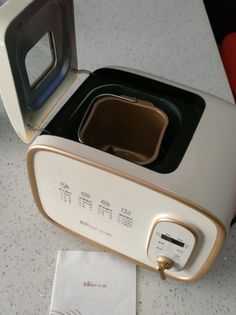 Bear Electric Bread Maker Machine (Category: Breadmakers) located in Singapore. Submitted by bellobell (Listing ID 1461626409, Image 2). Description: 29cm (left-right) x 23cm (height) x 21cm (width) $25 with free courier - White & Gold Bear Electric Bread Maker - Multiple settings for different bread types and doughs - Easy-to-use dial and digital display - Comes with bread pan and manual - Ideal for making delicious homemade bread.