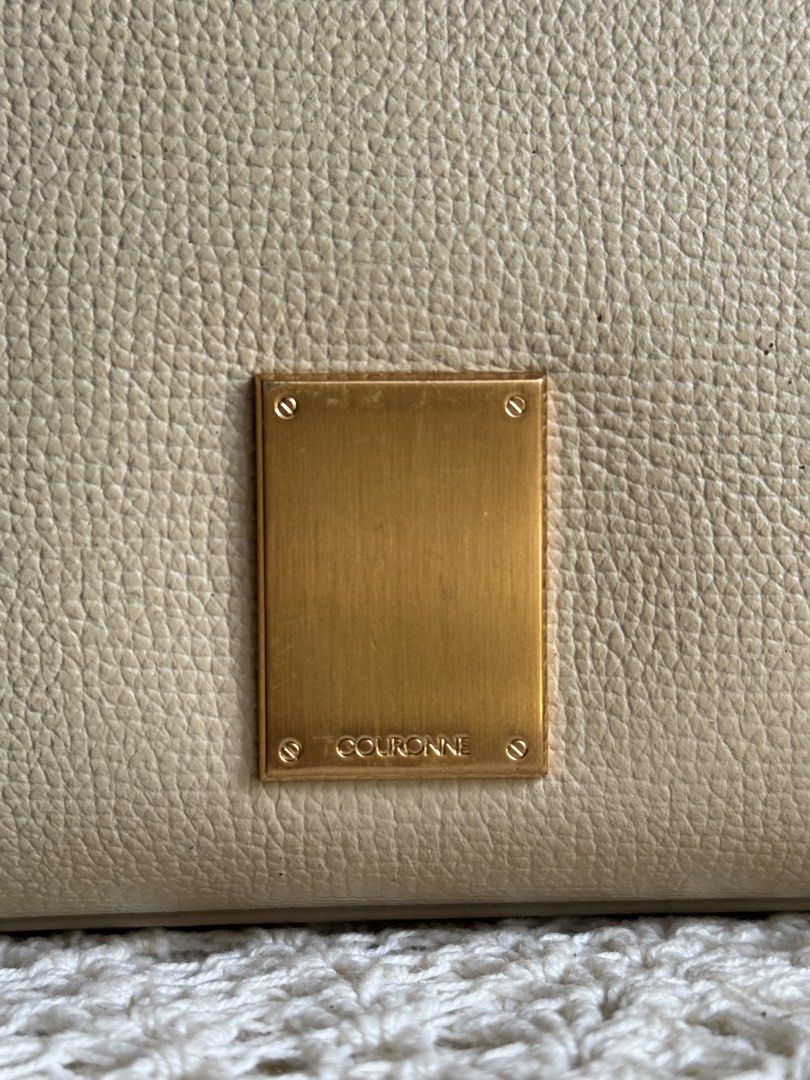 Beige Leather Top Handle Bag (Category: Luxury Bags & Wallets) located in Bacolod City. Submitted by vintage_vogue6100 (Listing ID 1461669529, Image 2). Description: - Color: Beige - Material: Leather - Design: Structured with top handles - Strap: Detachable shoulder strap included - Hardware: Gold-tone - Closure: Zipper - Interior: Clean - Style: Great everyday bag.