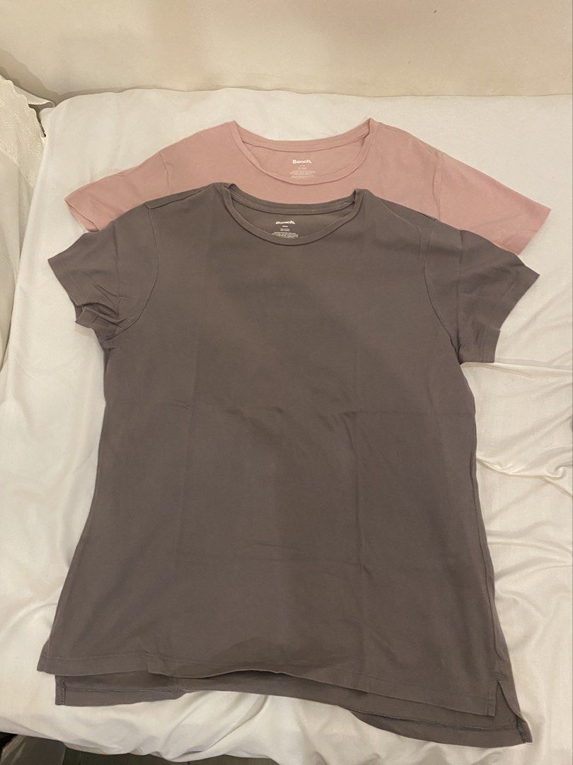 Bench T-shirts (2 pcs) - Pink & Grey (Category: Shirts) located in Quezon City. Submitted by pixavix (Listing ID 1461710118, Image 1). Description: - 60 EACH - 1 soft pink, 1 dark grey. - Classic short sleeves and crew neck design. - Comfortable and versatile for daily wear. - Ideal for layering or wearing solo. - Special bundle price when you buy both..