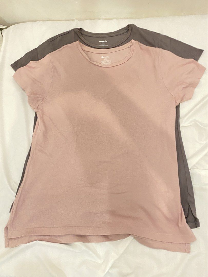 Bench T-shirts (2 pcs) - Pink & Grey (Category: Shirts) located in Quezon City. Submitted by pixavix (Listing ID 1461710118, Image 2). Description: - 60 EACH - 1 soft pink, 1 dark grey. - Classic short sleeves and crew neck design. - Comfortable and versatile for daily wear. - Ideal for layering or wearing solo. - Special bundle price when you buy both..