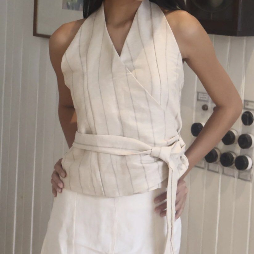 Beyond Collective Lily Wrap Top Size S (Category: Blouses) located in Manila. Submitted by kingchocnut (Listing ID 1461569370, Image 1). Description: - Bought for ₱1,429 - Used once!! - Style: Lily wrap top - Neckline: Halter neck - Waist: Tie waist - Size: S.