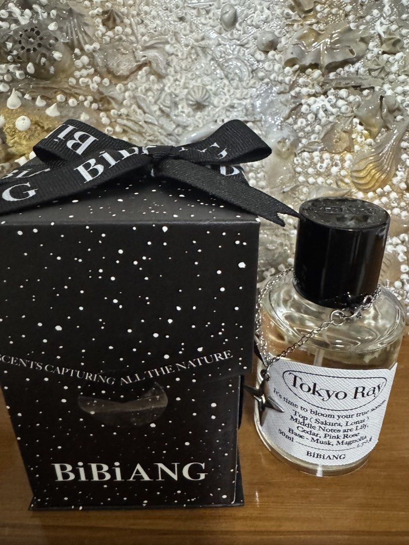 BiBiANG Tokyo Ray Eau de Parfum 50ml (Category: Fragrance & Deodorants) located in Manila. Submitted by xenasales (Listing ID 1461676032, Image 1). Description: - BiBiANG Tokyo Ray Perfume - Size: 50ml - Fragrance Notes: Sakura, Lotus, Lily, Cedar, Pink Rose, Musk, Magnolia - Features: Star charm on bottle - Packaging: Comes in a gift box with a ribbon - Ideal for: Gifting or personal indulgence.