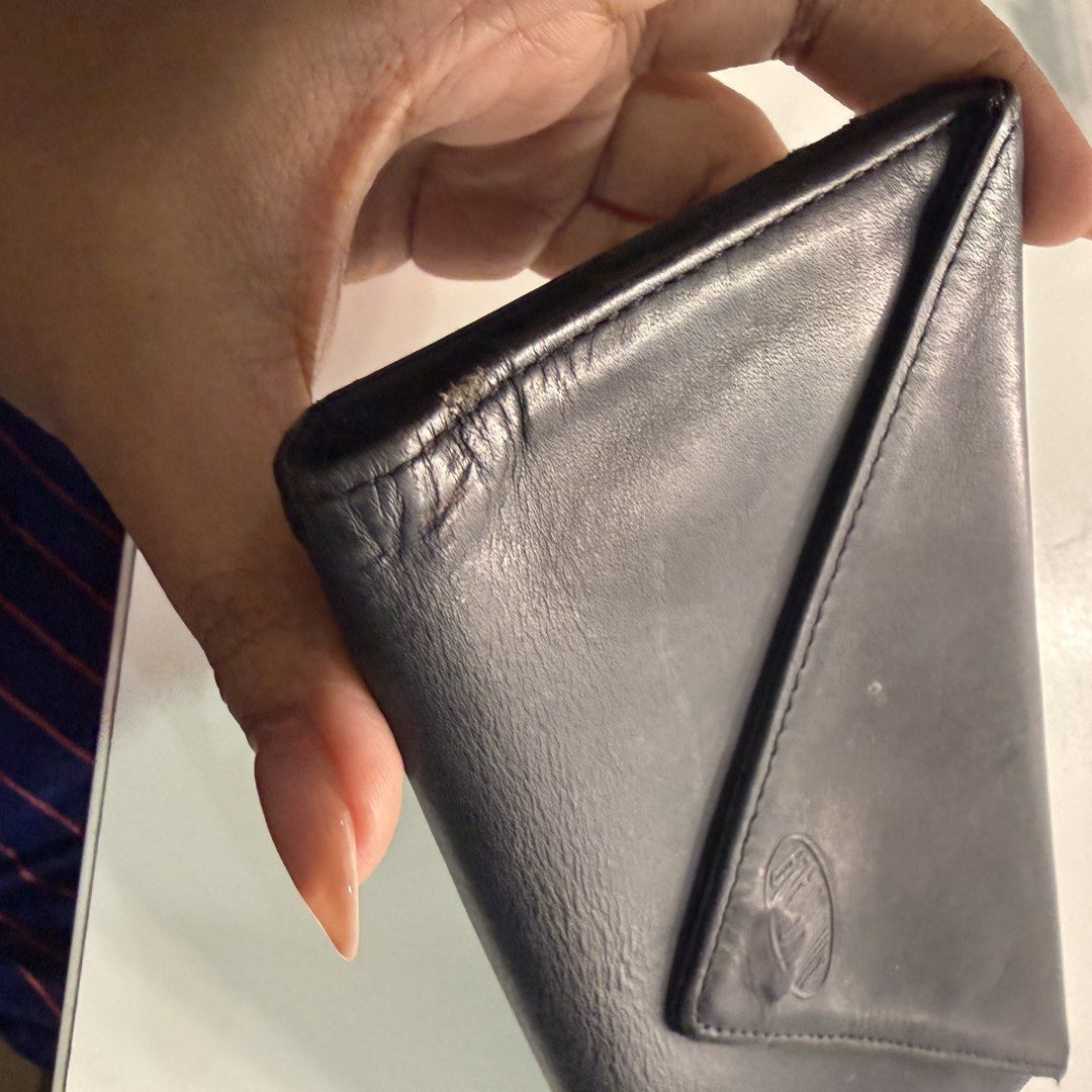 Big Skinny Black Leather Envelope Wallet (Category: Wallets & Card holders) located in Pateros City. Submitted by sachiereyes (Listing ID 1461770721, Image 3). Description: - Black leather wallet - Envelope style with V-shaped flap closure - Zippered pocket on the back - Shows some signs of wear on corners and edges - Leather is soft with some creasing.