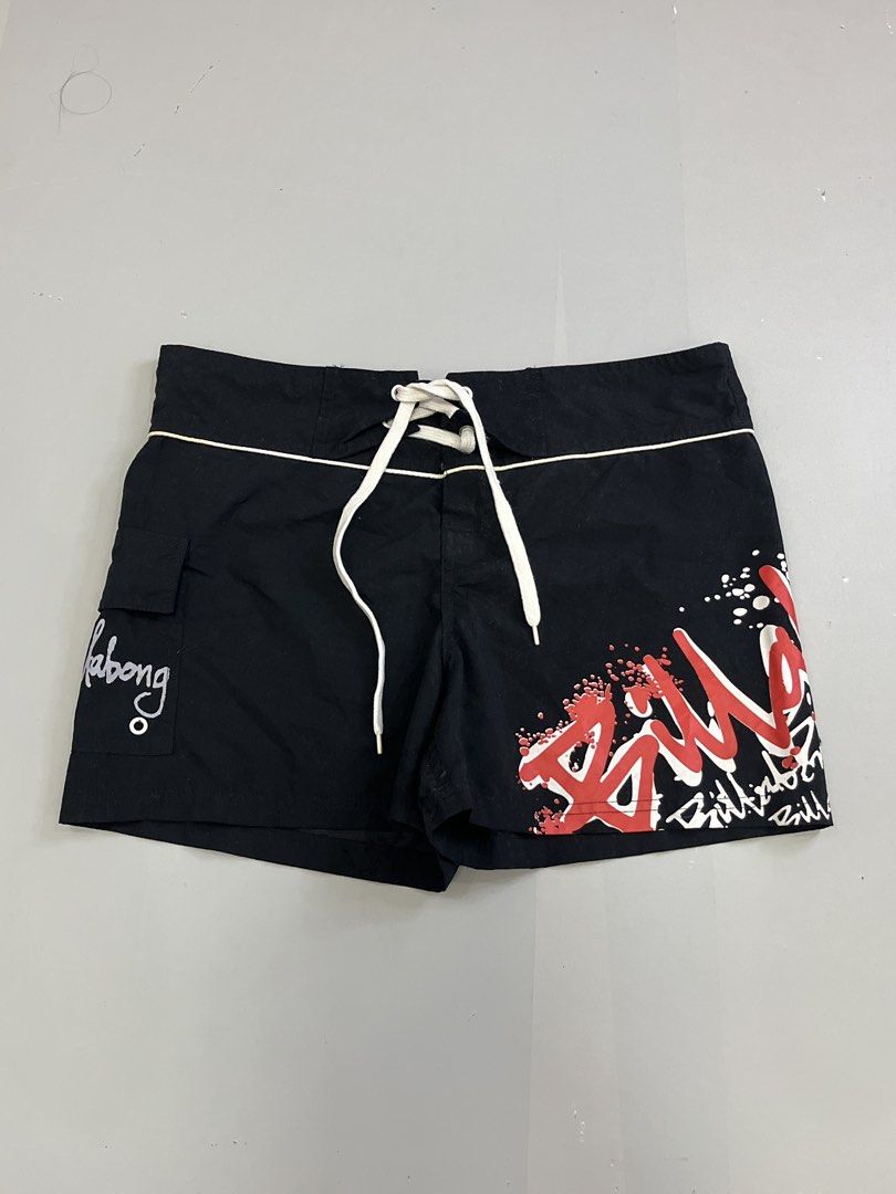 Billabong Black Board Shorts (Category: Swim Trunks & Board Shorts) located in Mabalacat. Submitted by aas_thriftfings (Listing ID 1461589727, Image 1). Description: - Brand: Billabong - Size: W34 L13 - Color: Black with red and white graffiti-style logo - Features: Drawstring waist, back pocket with button closure - Material: 100% Polyester - Origin: Made in Thailand.
