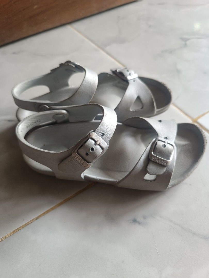 Birkenstock Silver Strap Sandals (Category: Flats & Sandals) located in Naga. Submitted by elzza_zenitram (Listing ID 1461624181, Image 2). Description: - Silver Birkenstock sandals - Two adjustable buckle straps across the front - Heel strap for a secure fit - Soles with good grip, perfect for everyday wear - Minor signs of use on footbed and straps 19cm insole.