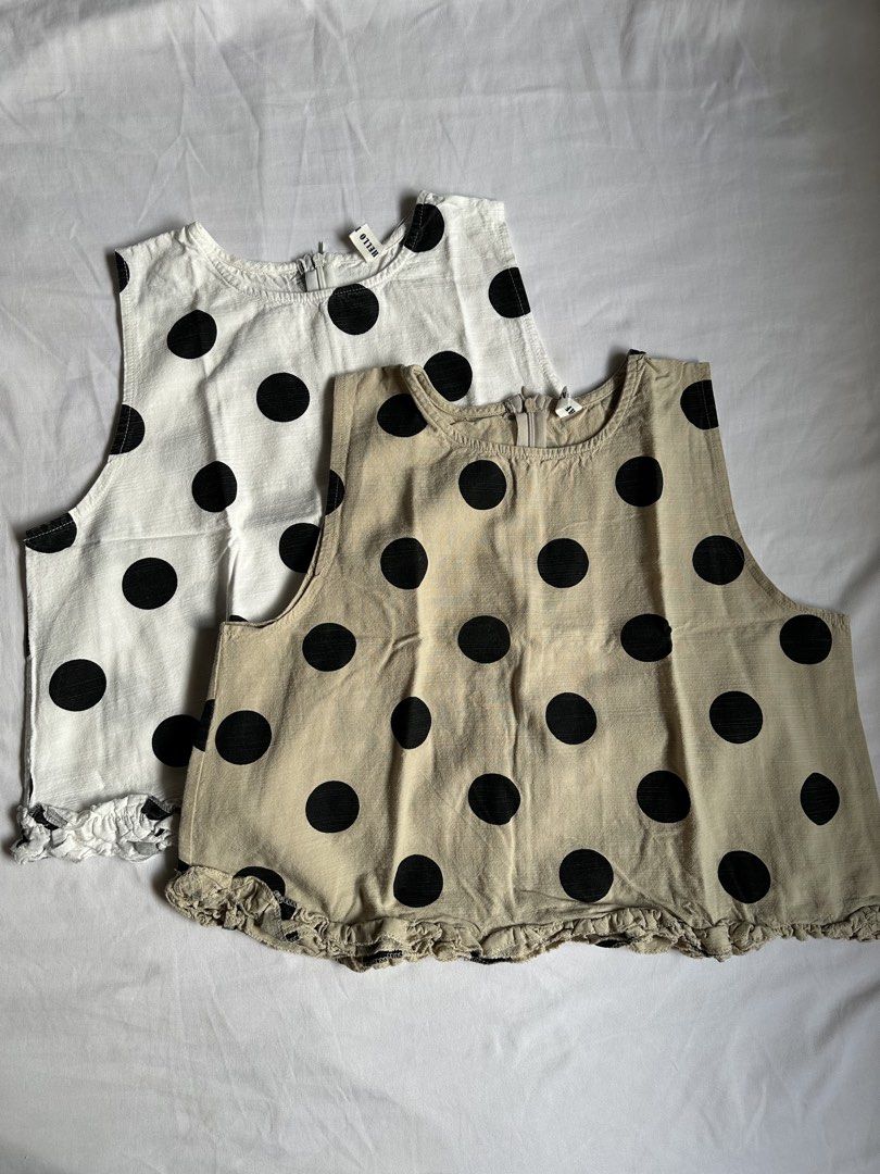 BKK Linen-blend Sleeveless (Category: Sleeveless) located in Bacolod City. Submitted by pym_shops (Listing ID 1461702481, Image 1). Description: ₱300 EACH - Two adorable sleeveless tops: one white with black polka dots, one beige with black polka dots. - Both tops have a charming ruffled hem detail. - Convenient zipper closure at the back. - Ideal for everyday casual wear..