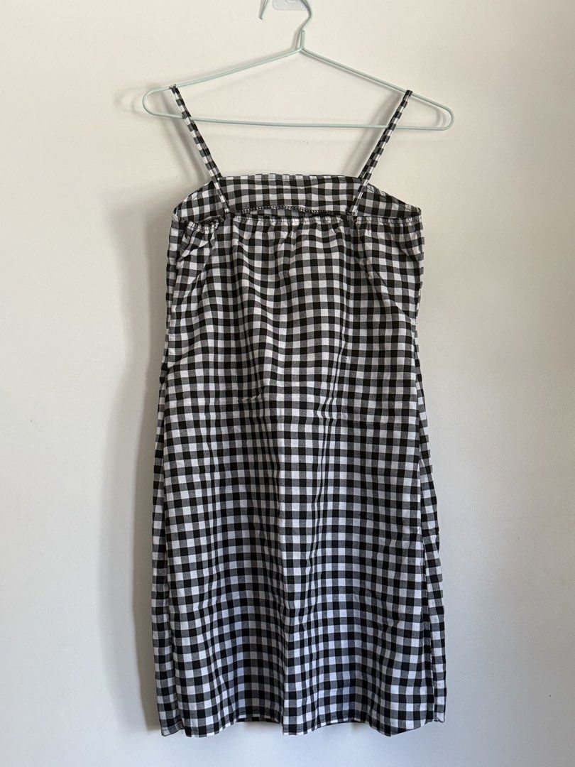 Black and White Gingham Spaghetti Strap Dress (Category: Dresses) located in Laoag. Submitted by rhedgejasm73385 (Listing ID 1461693478, Image 1). Description: - Adorable black and white gingham pattern - Flattering spaghetti straps - Chic square neckline - Comfortable elasticated bust - Versatile midi length - Ideal for casual outings or picnics - Effortlessly style with sneakers or sandals.