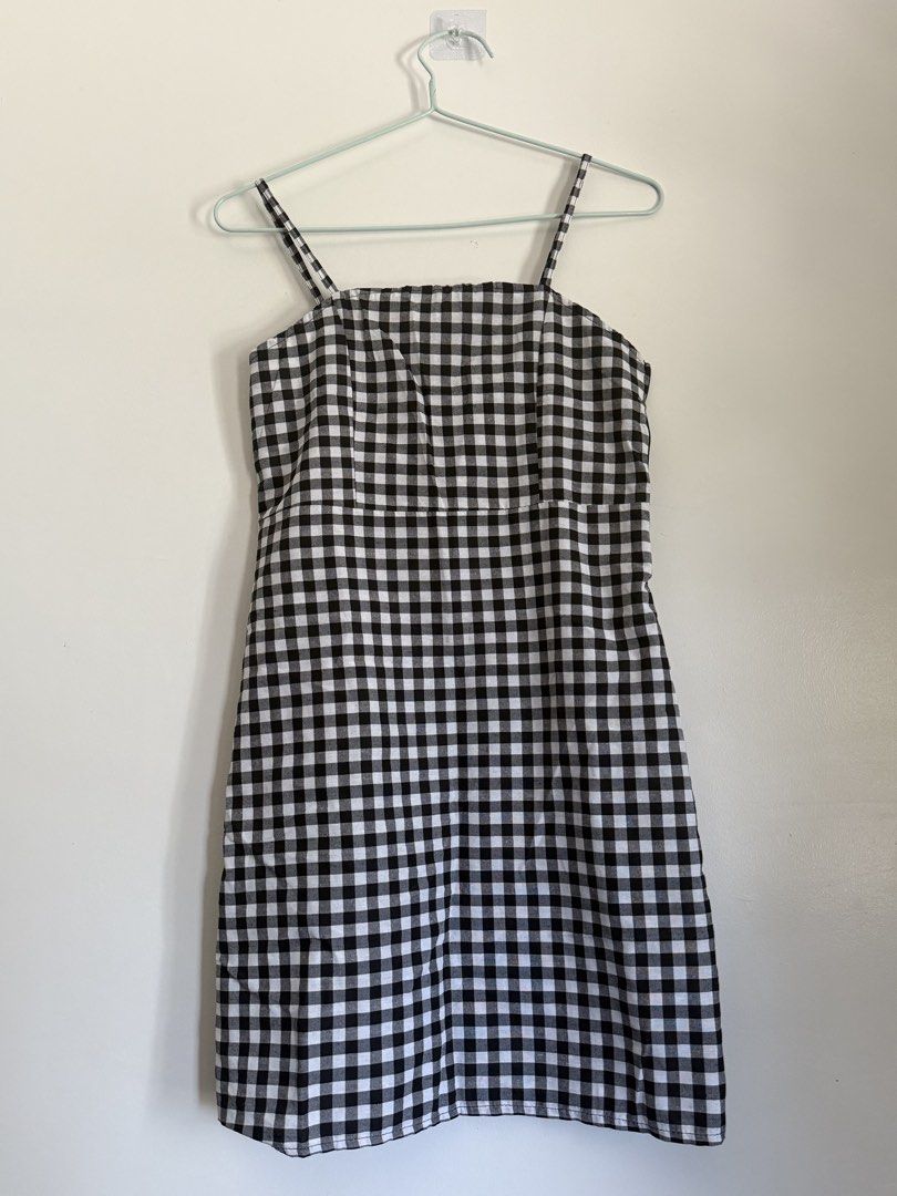 Black and White Gingham Spaghetti Strap Dress (Category: Dresses) located in Laoag. Submitted by rhedgejasm73385 (Listing ID 1461693478, Image 2). Description: - Adorable black and white gingham pattern - Flattering spaghetti straps - Chic square neckline - Comfortable elasticated bust - Versatile midi length - Ideal for casual outings or picnics - Effortlessly style with sneakers or sandals.