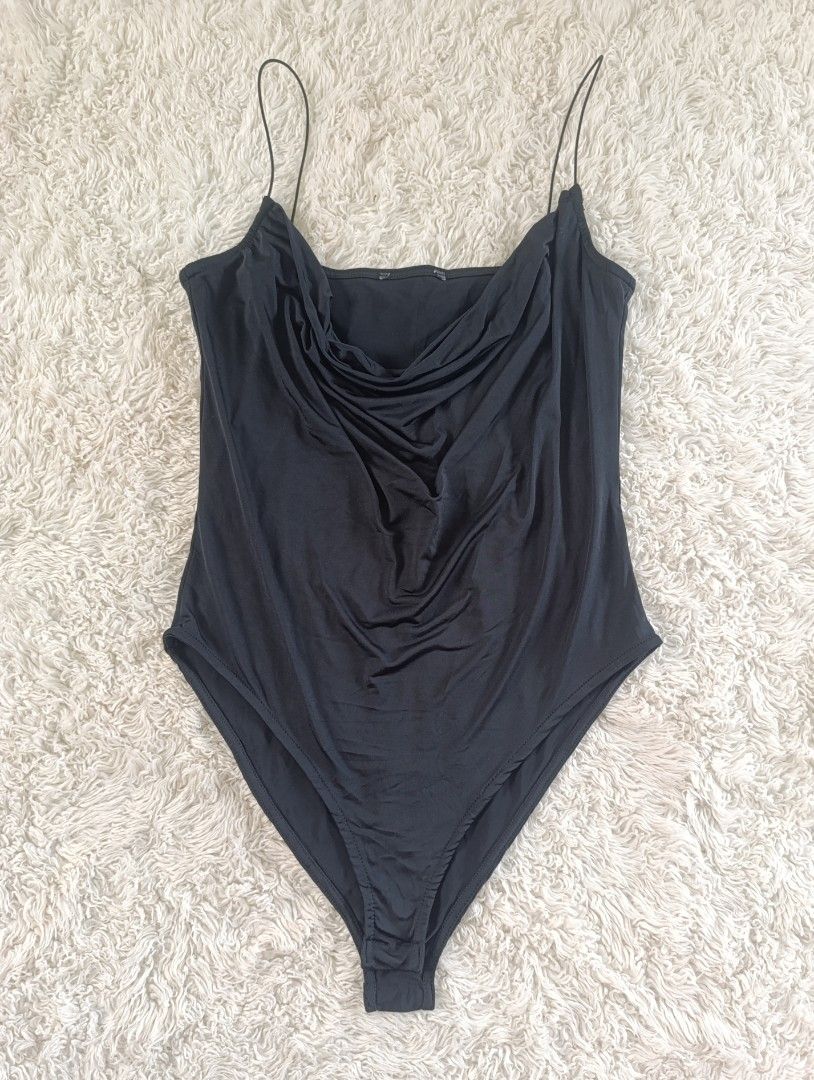 Black Cowl Neck Spaghetti Strap Bodysuit (Category: Sleeveless) located in Bocaue. Submitted by tacobellaaa (Listing ID 1461645255, Image 1). Description: - Sleek black bodysuit - Elegant cowl neckline - Delicate spaghetti straps - Fabric with beautiful drape - Versatile for layering or wearing alone - Convenient snap closure at the bottom.