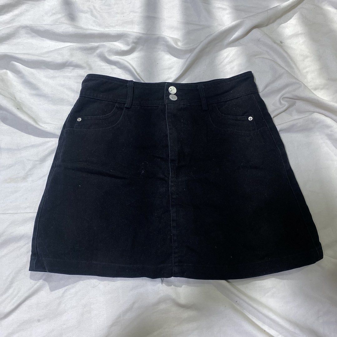 Black Denim A-Line Skirt with Double Button Closure (Category: Skirts) located in Rizal. Submitted by lili.s.choyce (Listing ID 1461727611, Image 1). Description: - Classic solid black denim skirt - Flattering A-line cut - Double button front closure - Functional pockets - Built-in shorts for added coverage - Size: 27-28 - Effortless to style with various tops and shoes.
