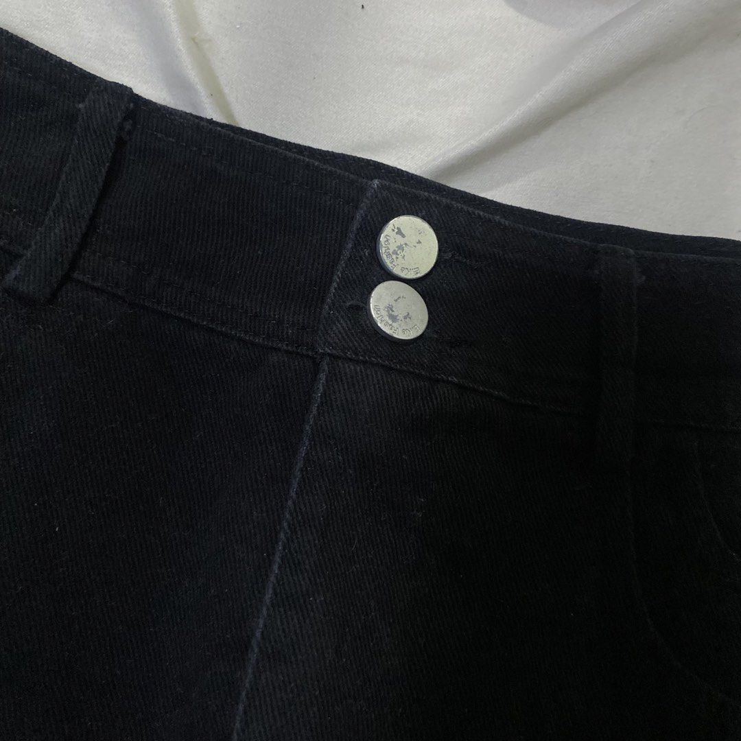 Black Denim A-Line Skirt with Double Button Closure (Category: Skirts) located in Rizal. Submitted by lili.s.choyce (Listing ID 1461727611, Image 2). Description: - Classic solid black denim skirt - Flattering A-line cut - Double button front closure - Functional pockets - Built-in shorts for added coverage - Size: 27-28 - Effortless to style with various tops and shoes.
