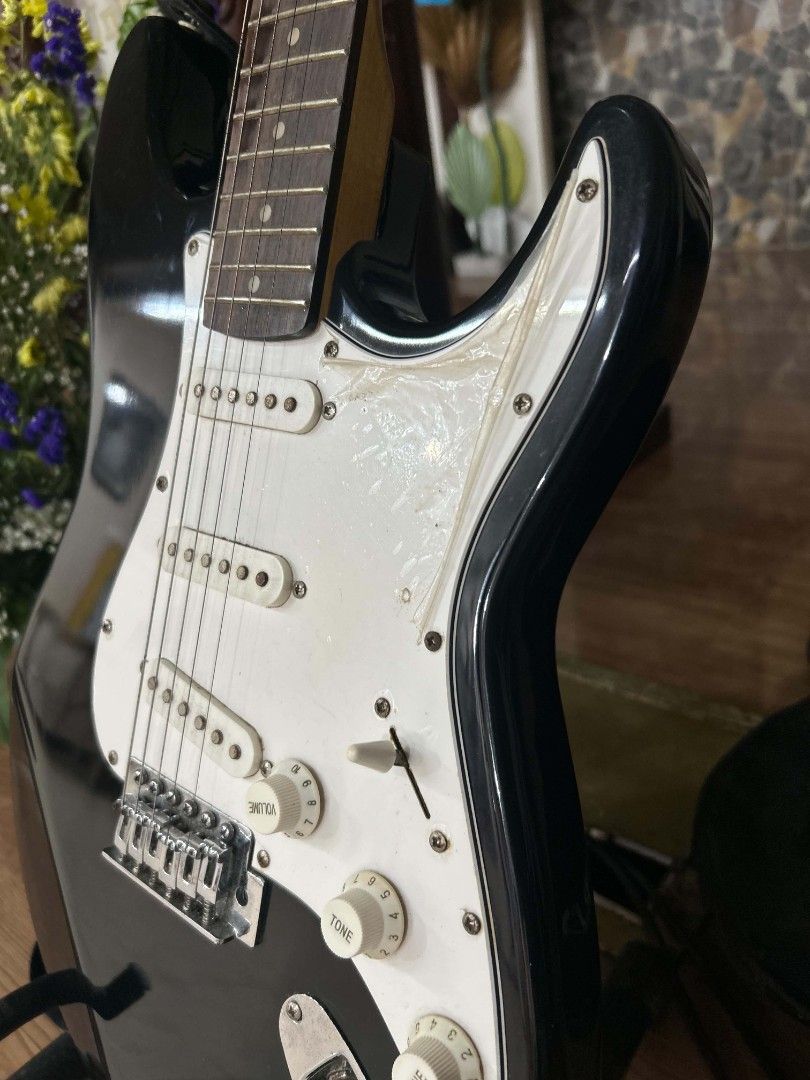 Black Electric Guitar with White Pickguard (Category: Musical Instruments) located in Manila. Submitted by grace_san48 (Listing ID 1461760931, Image 3). Description: - Sleek black electric guitar - Classic white pickguard and pickups - Standard volume and tone controls - Comes with a guitar strap - Perfect for a new musician or collector! *Gifted and barely used. Stored ever since—just needs new strings!.